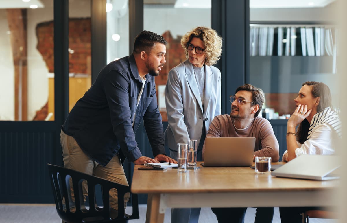 Professional team collaborating in modern office environment